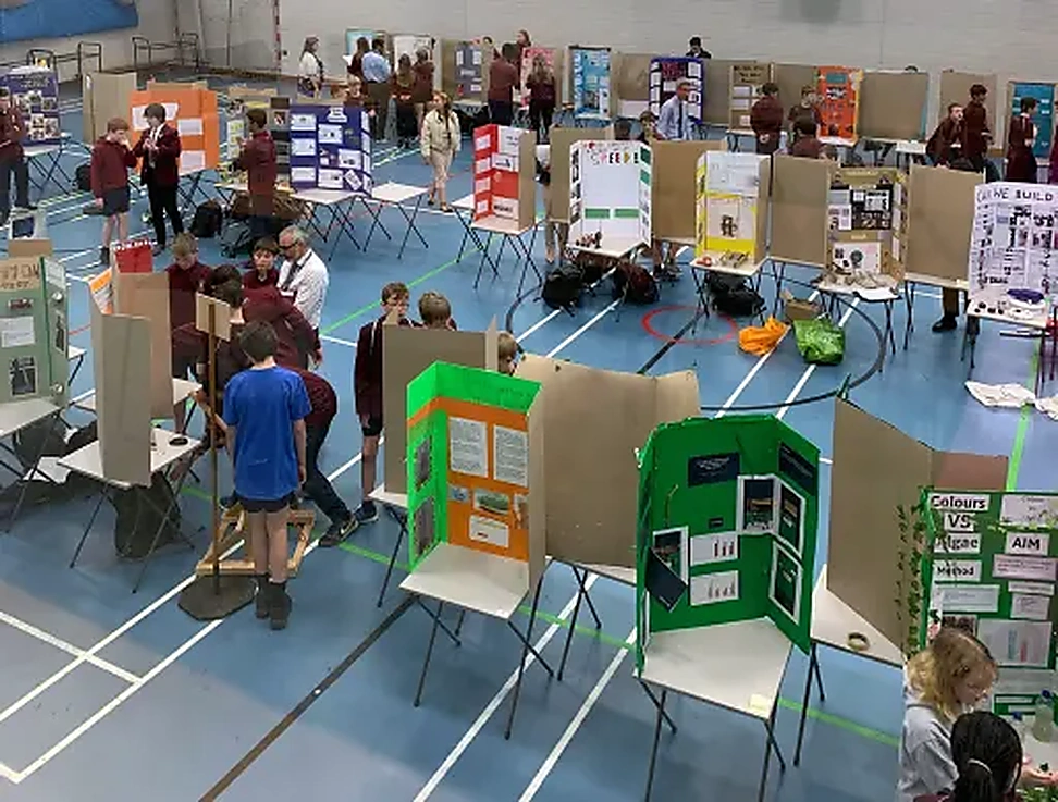 Students presenting projects at a school STEM event